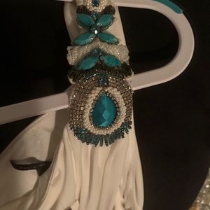 One Shoulder Gown with embellishments.